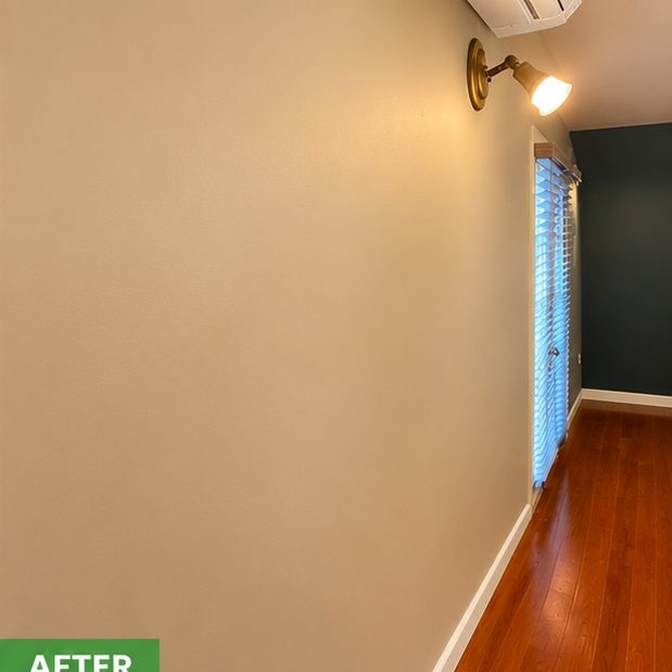 After: the same wall patched and repainted in a warm neutral