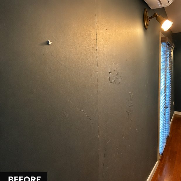 Before: dark wall with cracks and scuffs in a home office